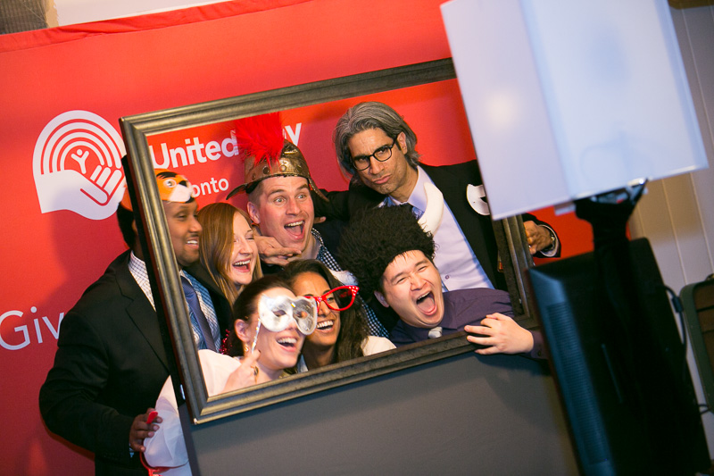 guests having fun in the fundraiser photo booth