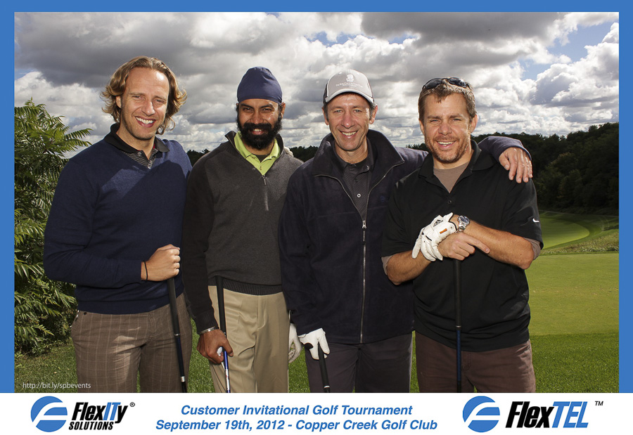 a golf foursome photo taken with a photobooth