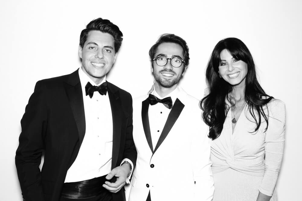 black-and-white-wedding-photo-booth-3 three people in a b+w wedding photo booth