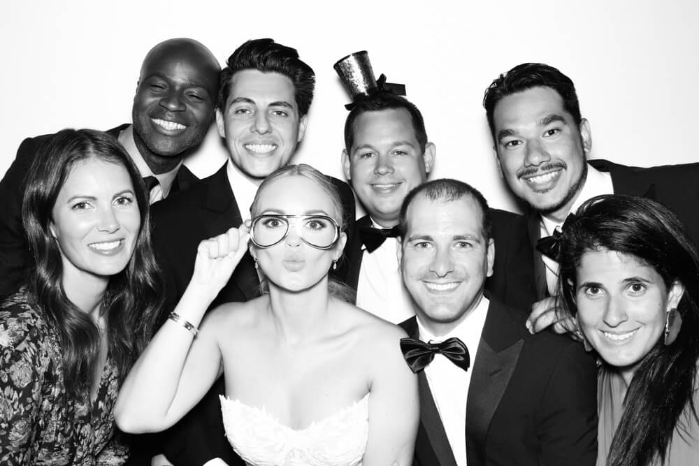 a group in the black and white photo booth