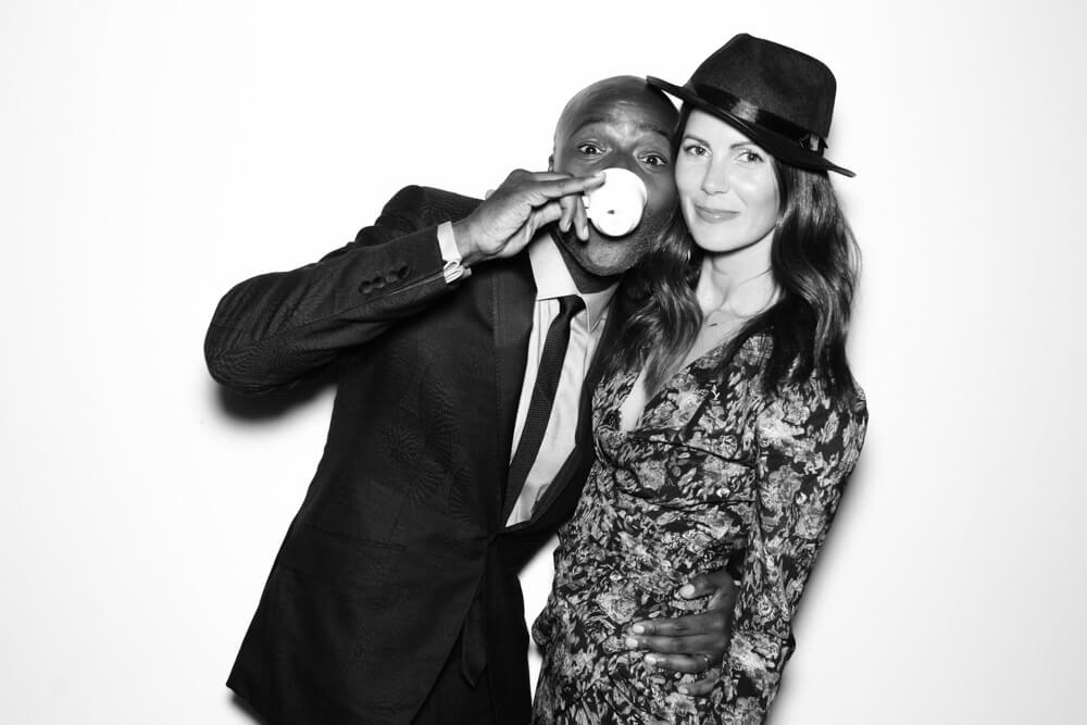 black-and-white-wedding-photo-booth-6 a gorgeous couple drinking tea in the photo booth