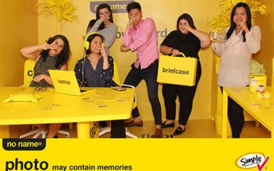 People posing on an all yellow set