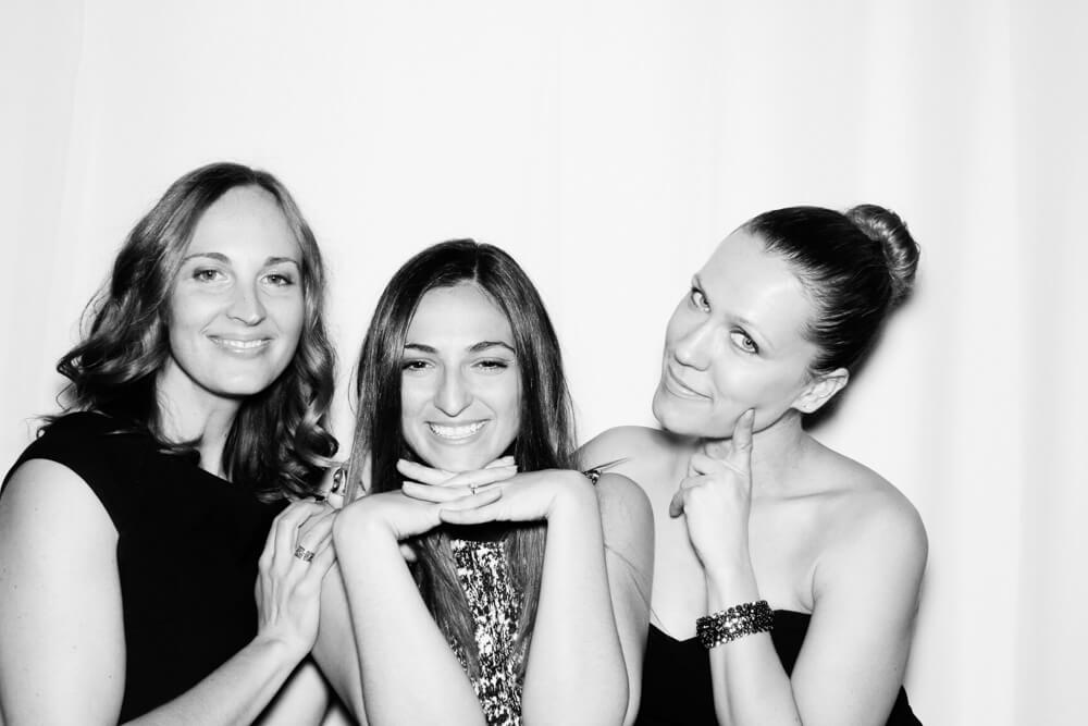 ladies posing in the photo booth