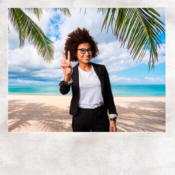 woman posing on a beach using a virtual photo booth