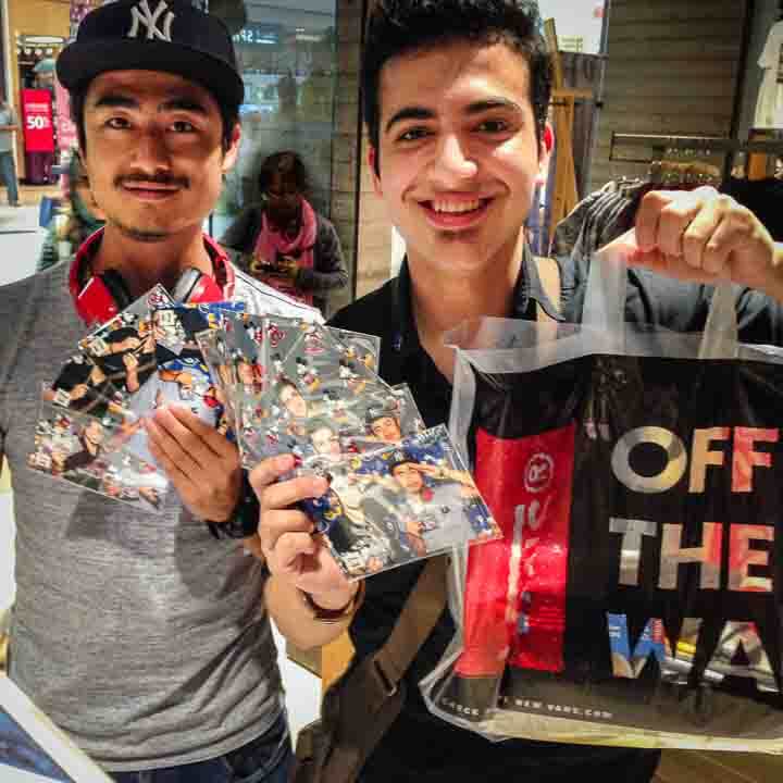 Two young guys showing their photo booth photos in a Vans store in Yorkdale Mall in Toronto