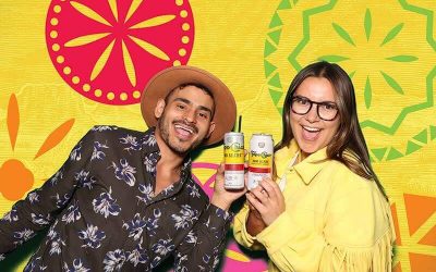 Two models at a beverage product launch green screen photo booth in Toronto