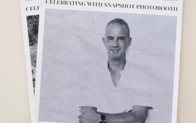 a photo of a newspaper print with the name of the guest and photo on the front cover