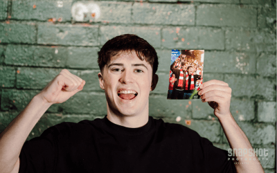 A man holding a printed AI photo