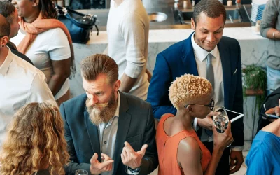 People at a corporate event engaging and conversing.