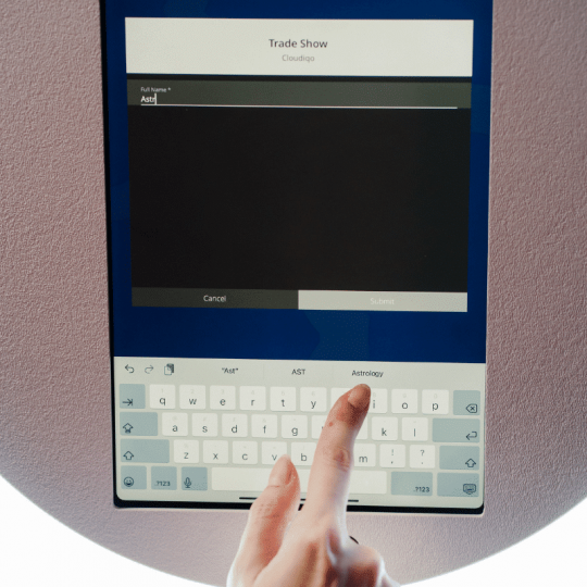 interactive-touchscreen-data-capture-interface Interactive touch-screen interface displaying custom data capture fields for attendee registration and lead collection at a corporate event booth.